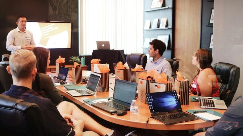 Team building an account-based marketing strategy in a conference room